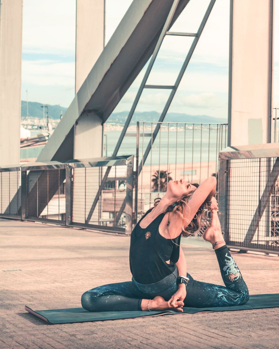 Xana Dahdal in a seated yoga pose outdoors